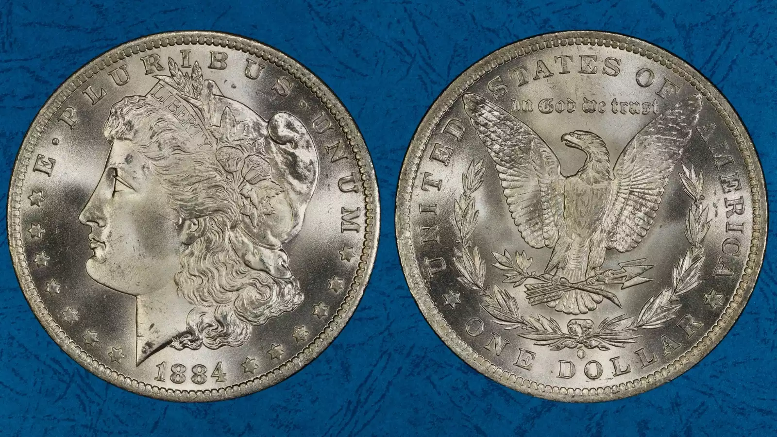 Grading strip showing four 1884 Morgan dollars from worn Good condition through circulated Very Fine through About Uncirculated to Mint State MS64